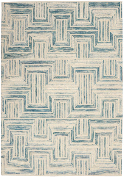 Cream area rug with teal-blue concentric square maze pattern; modern geometric woven design.