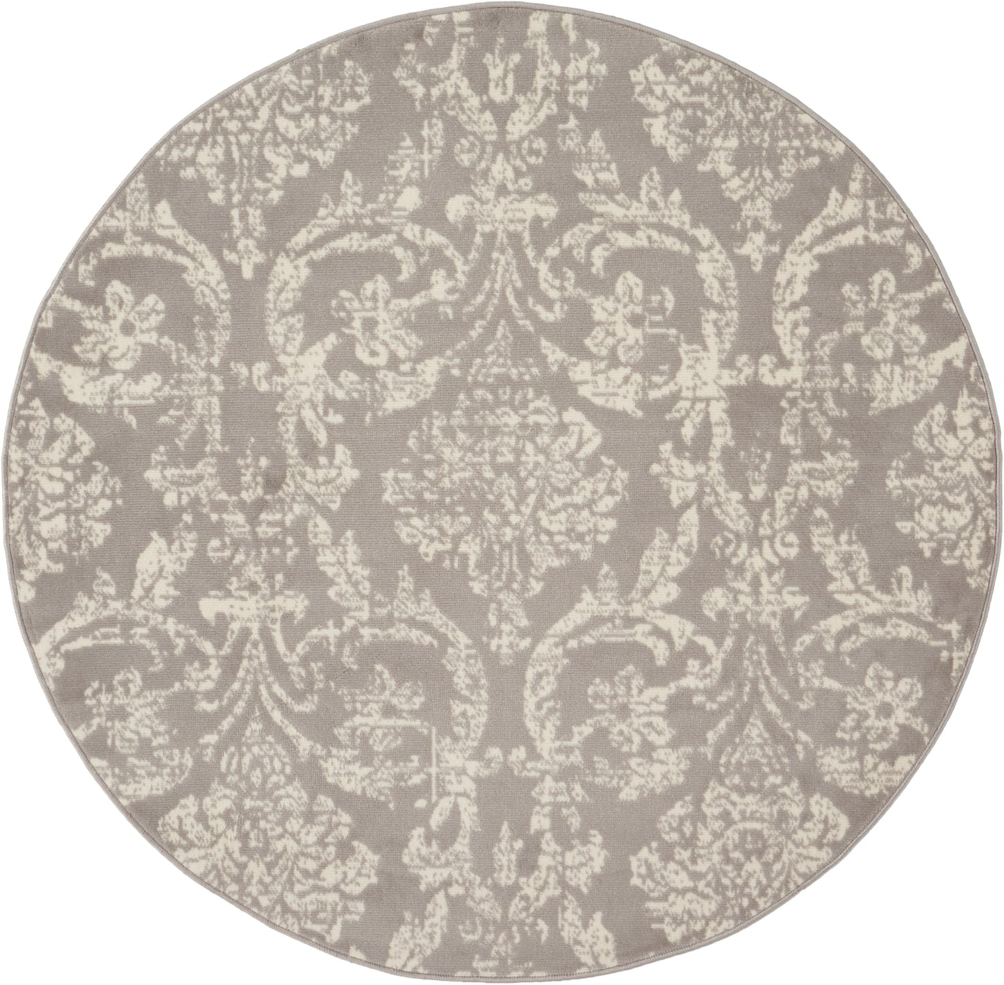 Round taupe rug with cream damask pattern; traditional decorative textile.
