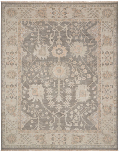 Rectangular area rug with muted gray center and ivory-beige floral border; vintage Persian-inspired pattern in tones.