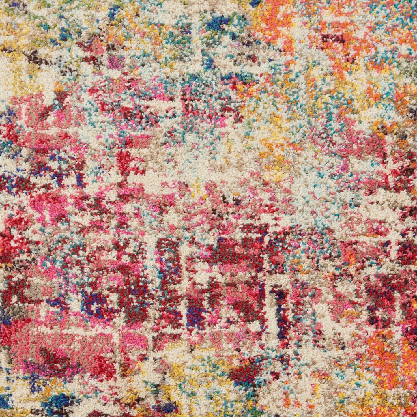 Shaggy area rug with cream base and vibrant splashes of pink, yellow, blue, teal; plush tufted texture, modern boho style.