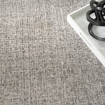 Gray woven rug backdrop with white tray and black circular gas burner rings.