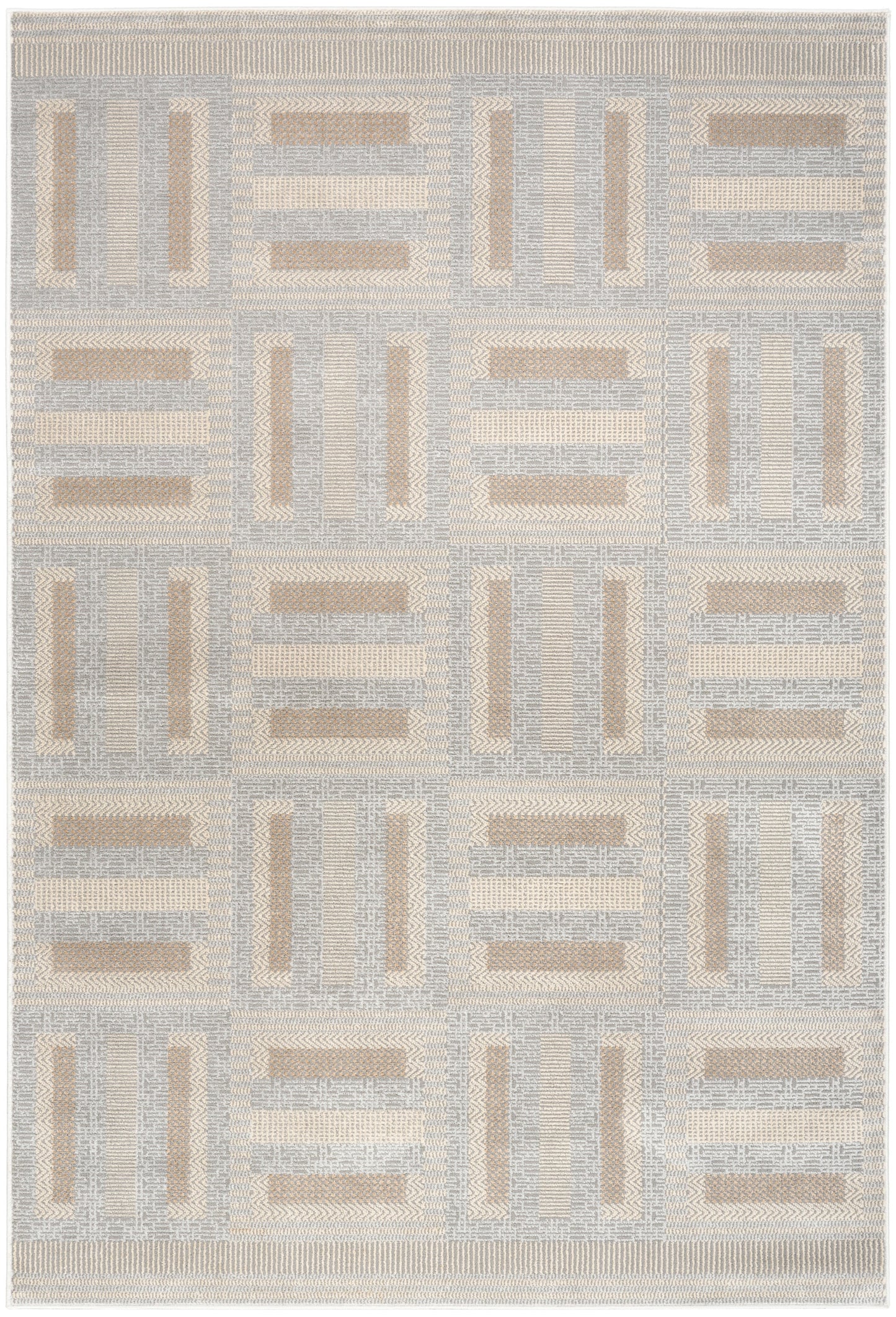 Geometric patchwork area rug in pale gray and beige tones; woven textile for modern living spaces.