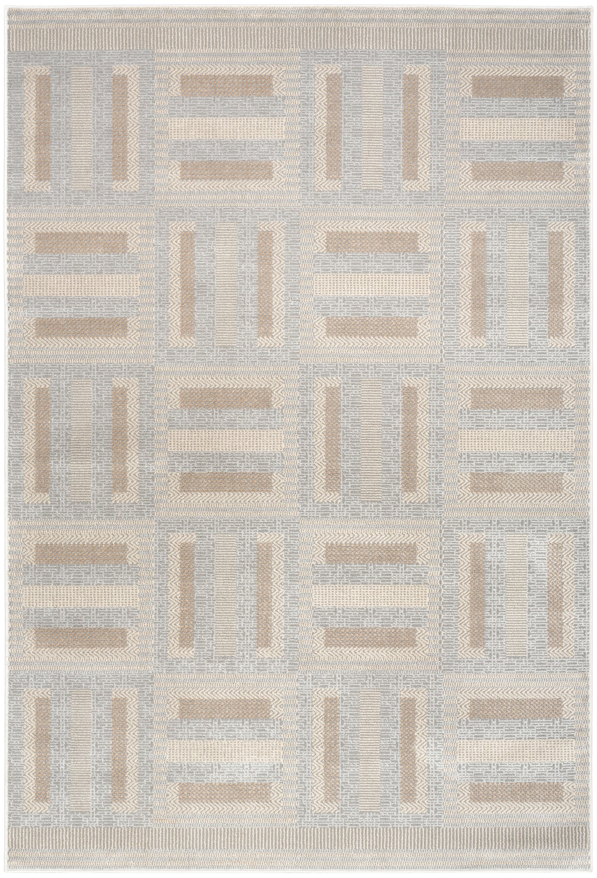 Geometric patchwork area rug in pale gray and beige tones; woven textile for modern living spaces.