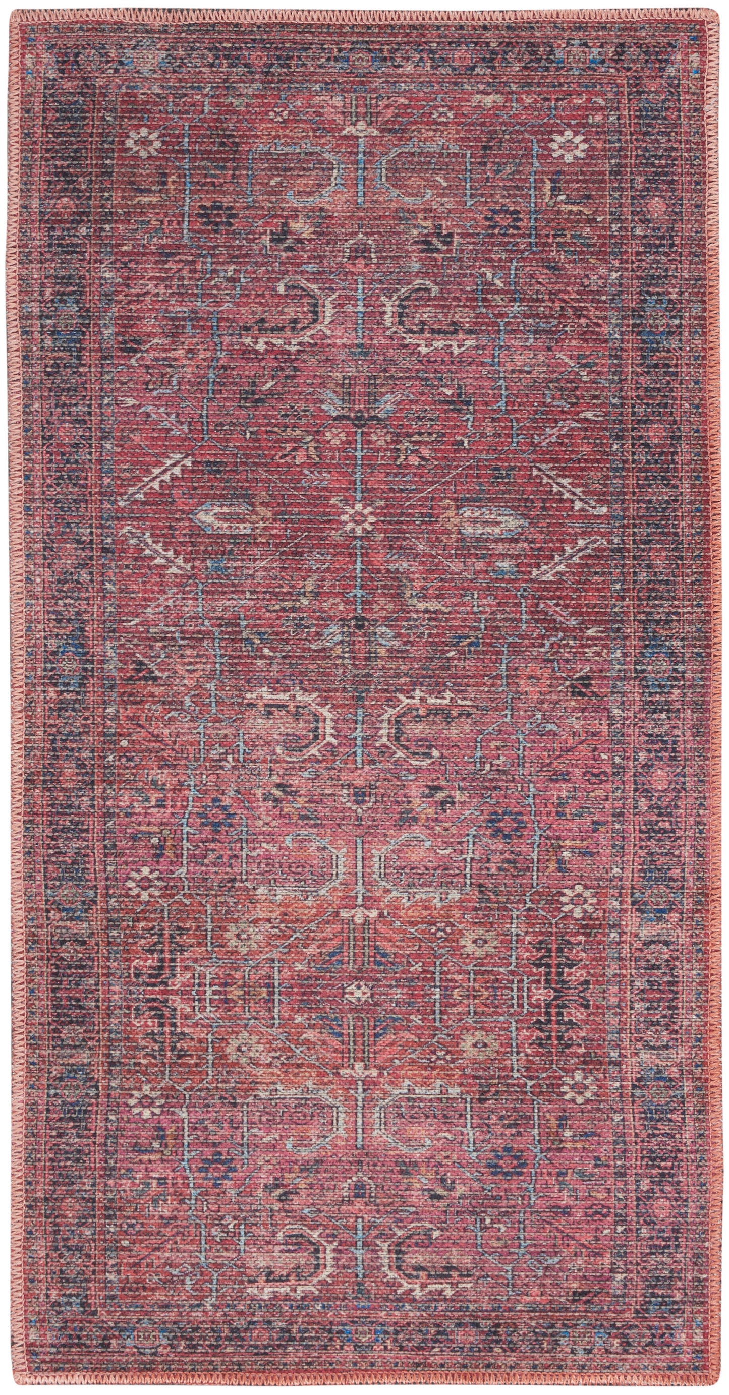 Rectangular red Persian-style rug with blue/ivory geometric motifs and a dark blue border; pink fringe.