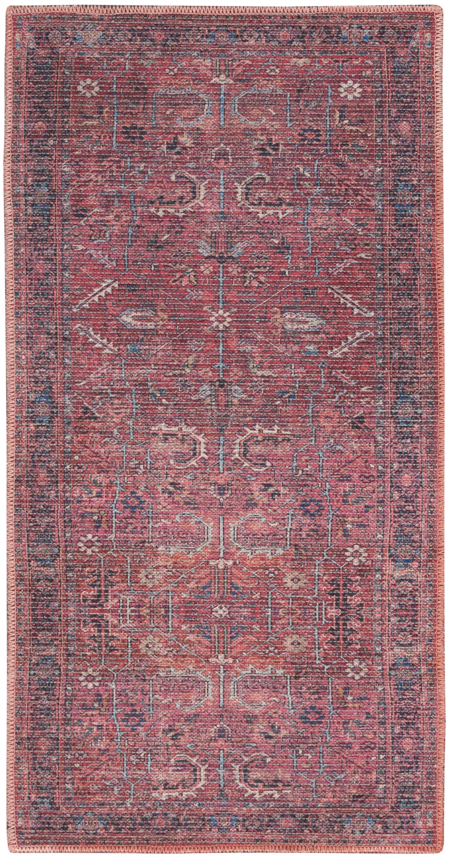 Rectangular red Persian-style rug with blue/ivory geometric motifs and a dark blue border; pink fringe.