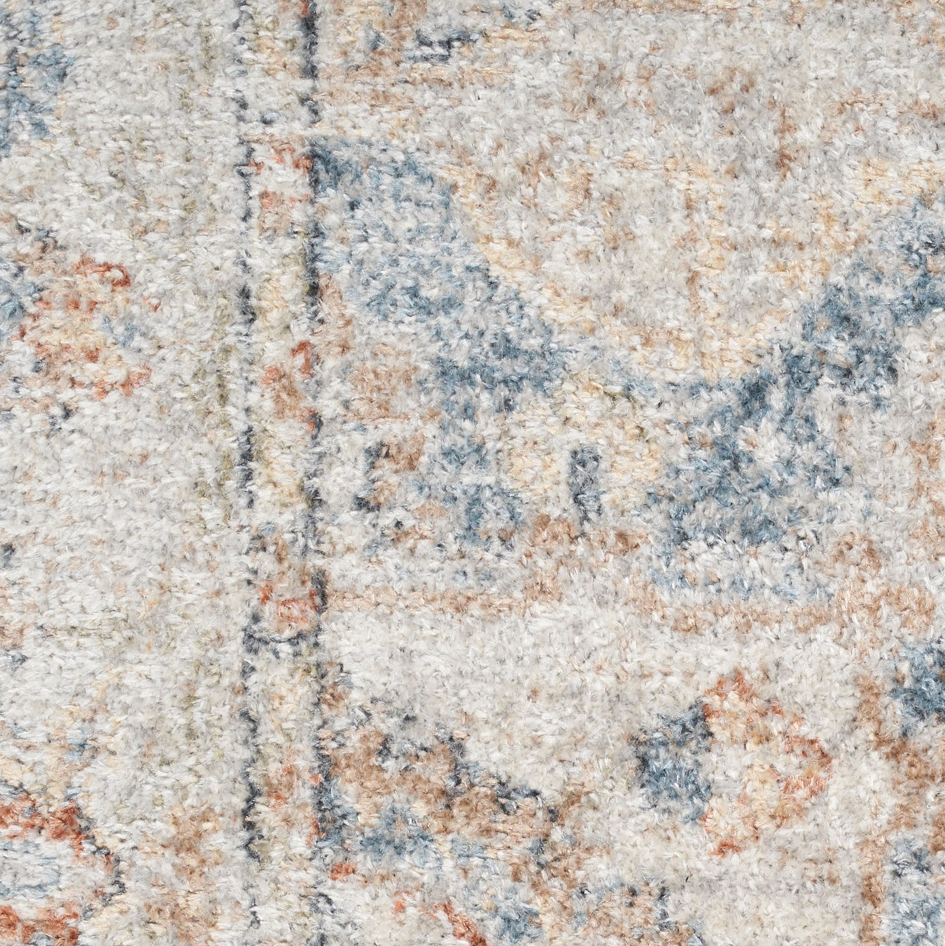 Cream distressed area rug with blue and orange floral motifs, plush textured pile, vintage-inspired design.