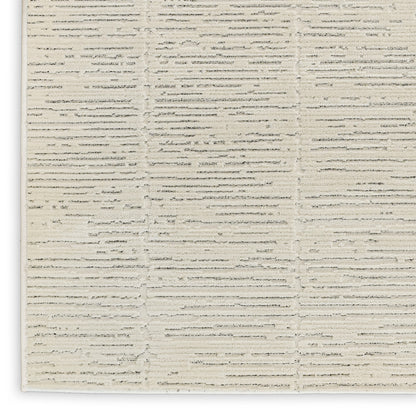 Cream textured rug with horizontal ribbed stripes; woven beige and ivory flat-weave for modern living spaces.