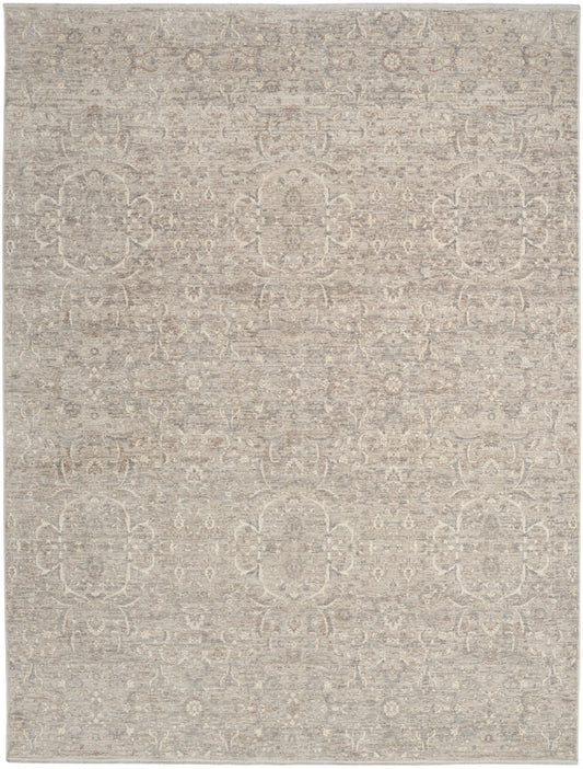 Neutral beige area rug with subtle vintage medallion and floral motifs; soft woven texture.