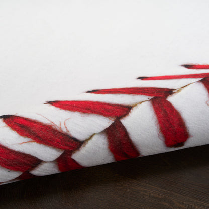 Round white rug with red braided tassel trim around the edge, laid on dark wood surface, 5' round.