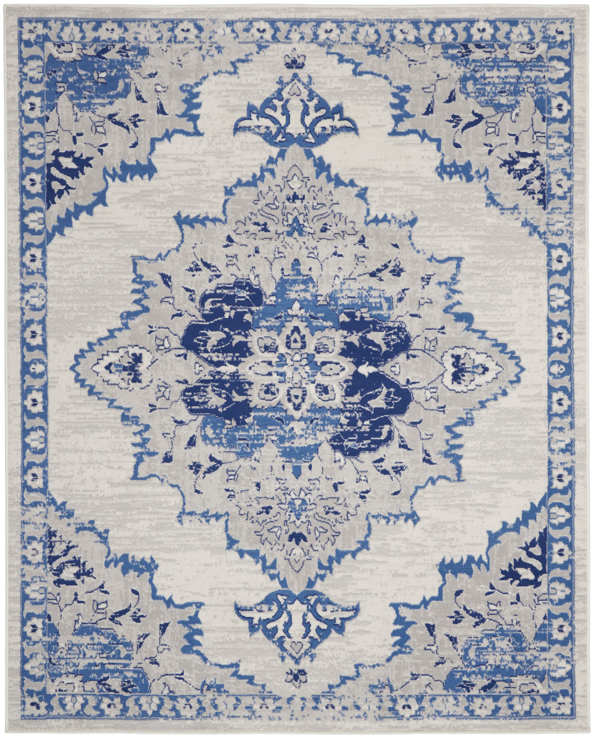 Rectangular area rug with distressed ivory background and indigo-blue floral medallion, ornate border; Persian-inspired.
