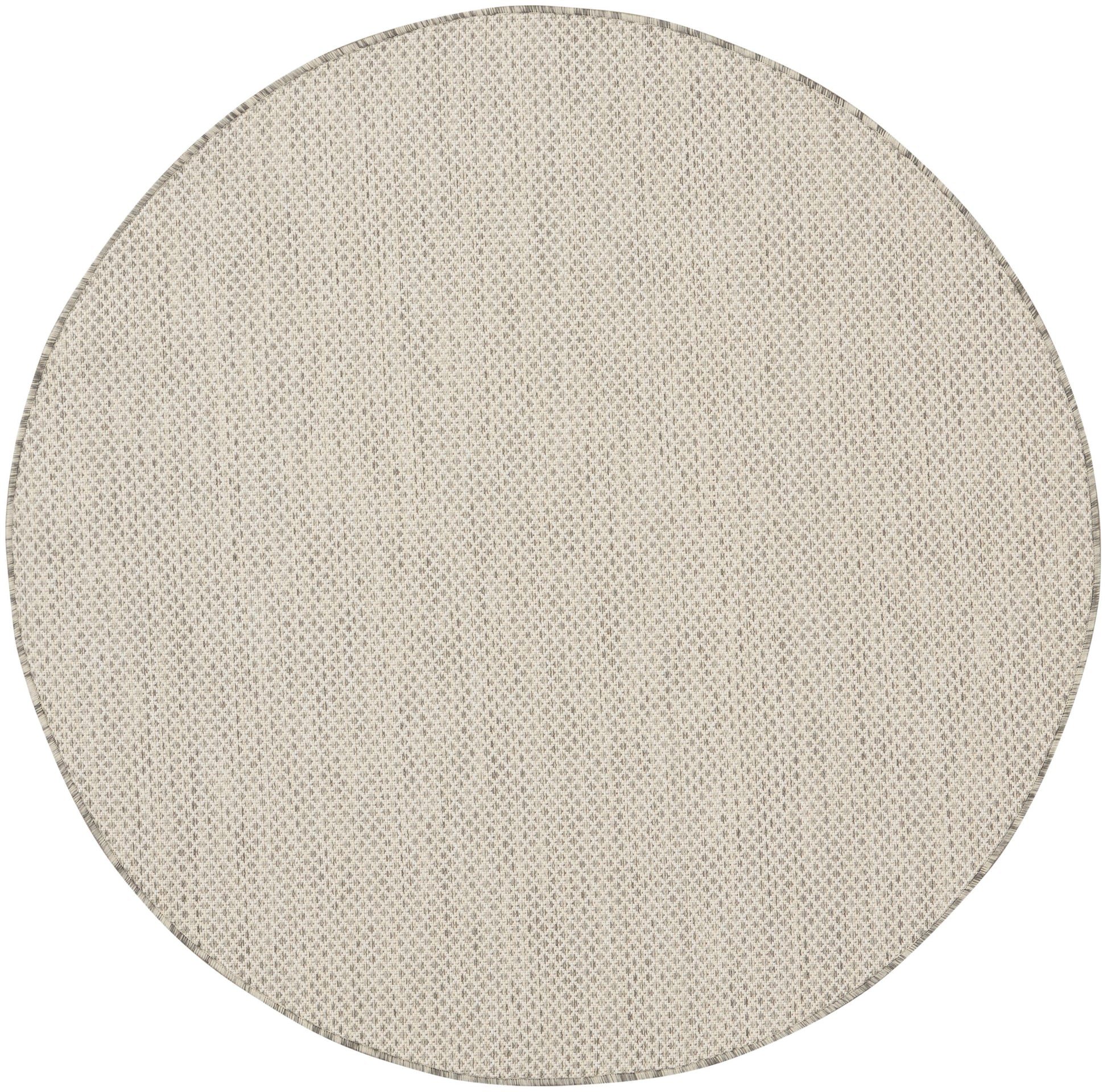 Round beige woven rug with natural fiber texture; neutral floor decor for living spaces.