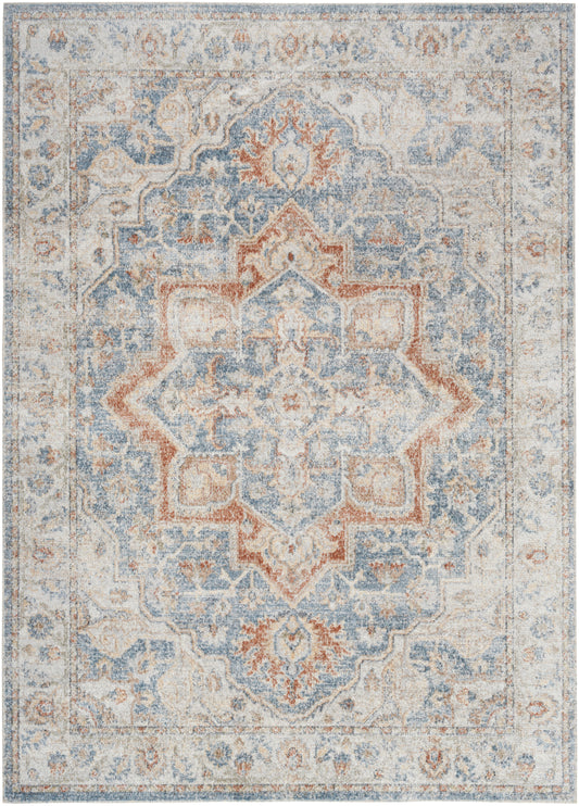 Distressed vintage-style Persian-inspired area rug in blue, ivory and rust with a central ornate medallion and border.