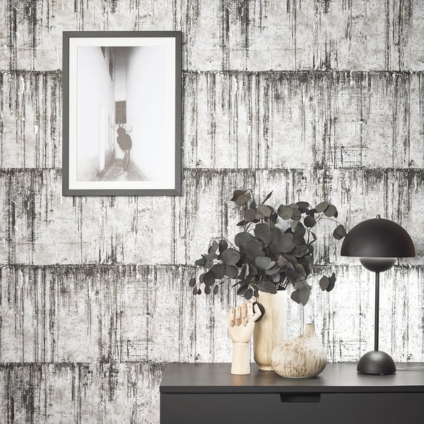 Grey concrete-look wallpaper.