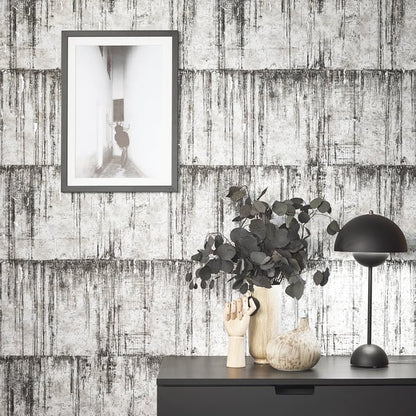 Grey concrete-look wallpaper.