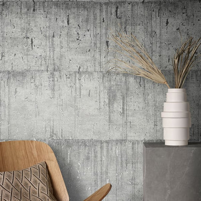Wallpaper with an aged concrete pattern in silver grey.
