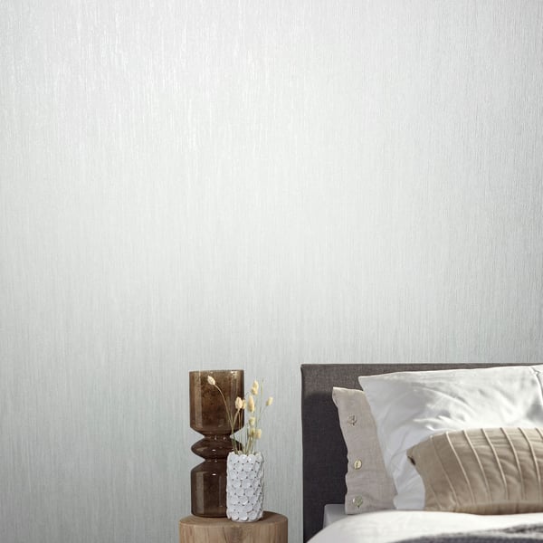 White air-slub textured wallpaper on a wall; subtle fabric-like texture.
