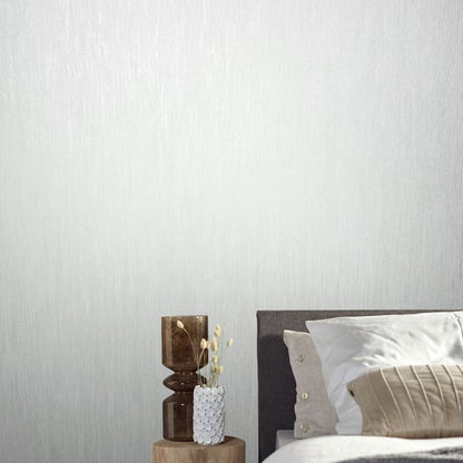 White air-slub textured wallpaper on a wall; subtle fabric-like texture.