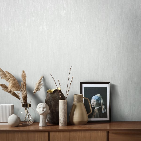 White wallpaper swatch with a subtle textured surface.