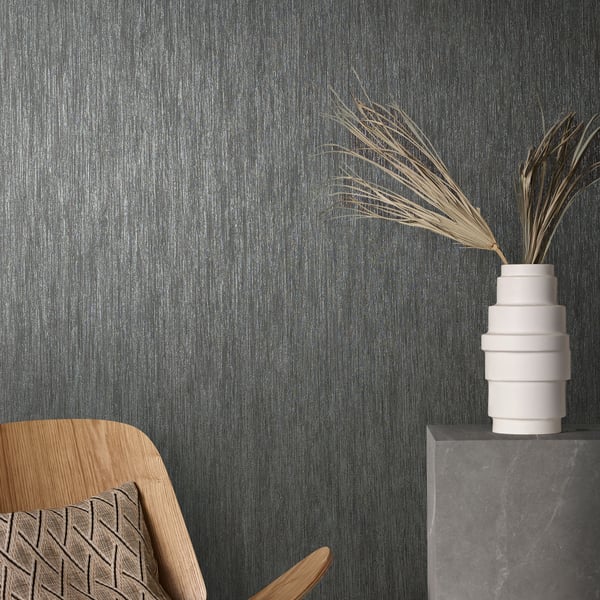 Black wallpaper with a subtle, airy waterfall-style pattern on a wall.