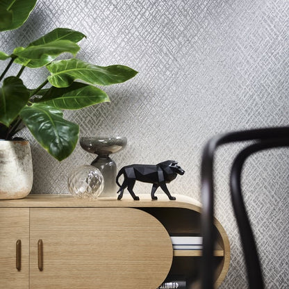 Close-up of a frosted silver grey crosshatch wallcovering.
