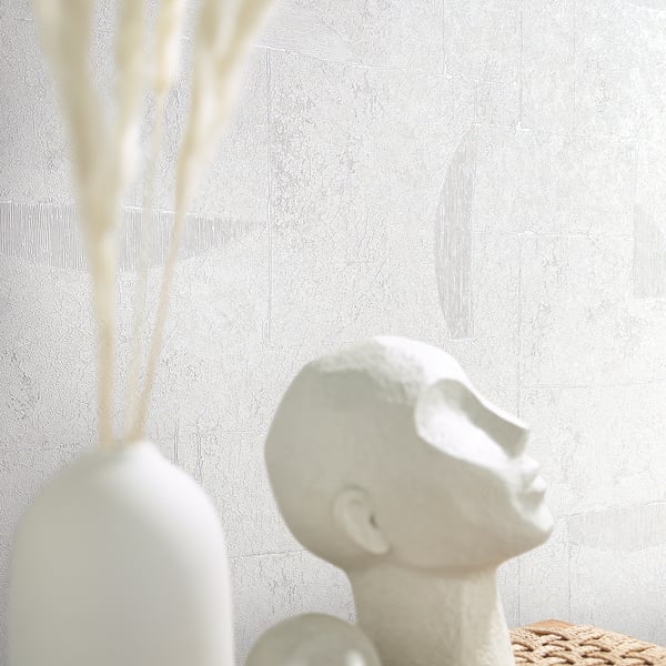 White wallpaper with a subtle geometric pattern.