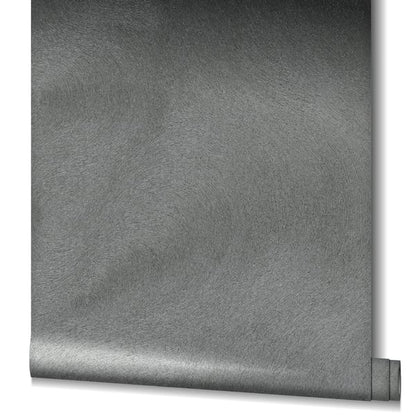 Gray wallpaper with brushed texture and circular swirl pattern, featuring a small rolled-edge detail.