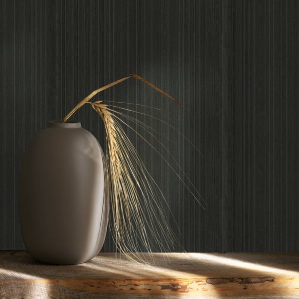 Close-up of black striped wallcovering sample with a matte finish.