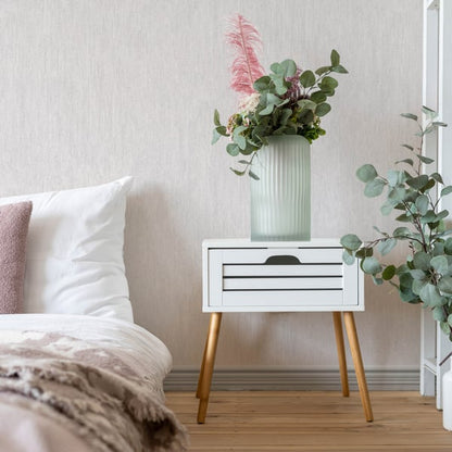 White wallpaper swatch with a subtle textured finish.