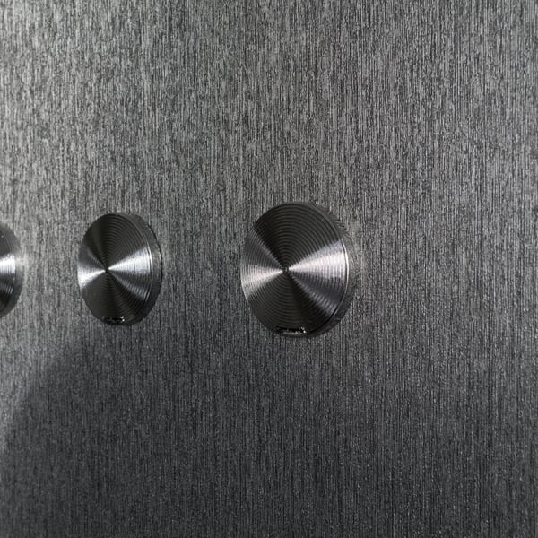 Silver grey wallpaper with a brushed metallic finish.