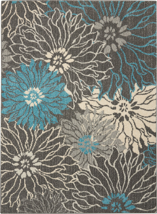Floral area rug featuring large cream, gray and teal flowers on a charcoal background.