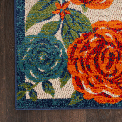 Rectangular outdoor rug with large orange and teal roses, green leaves, teal border; 4' x 6'.