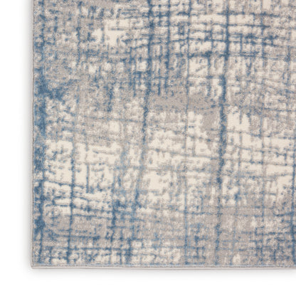 Rectangular runner rug with blue and cream distressed abstract grid pattern and light edge binding.