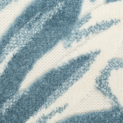Close-up of blue chenille stripes on cream woven rug, fluffy texture and abstract pattern.