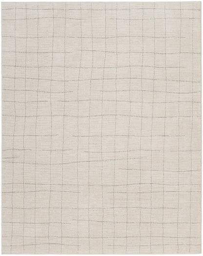 Cream rug with a subtle gray square grid pattern.