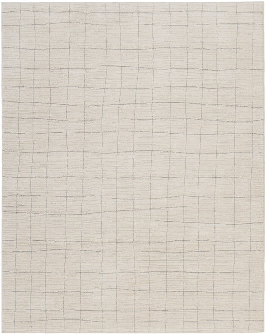Cream rug with a subtle gray square grid pattern.