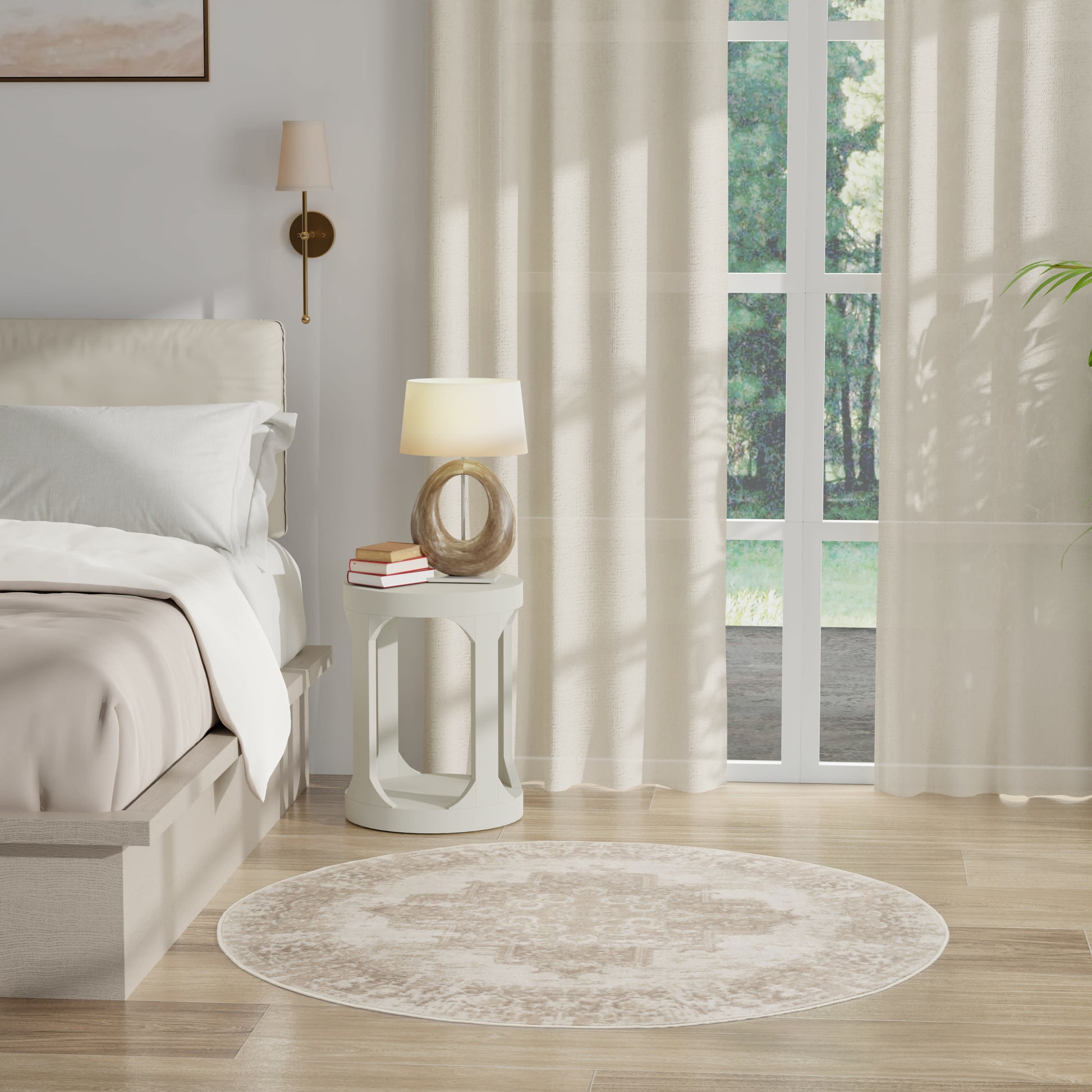 Neutral-toned bedroom with white bed, round wooden lamp base on nightstand, beige rug, sheer curtains.