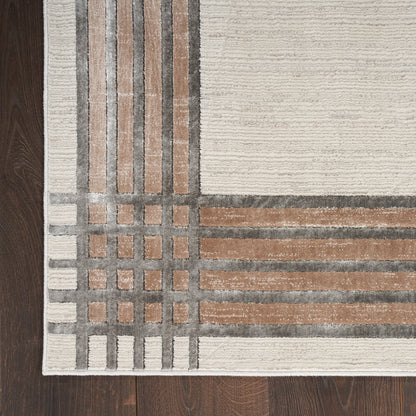 Modern geometric runner rug in beige, taupe and brown blocks with grey grid lines and cream border on dark wood floor