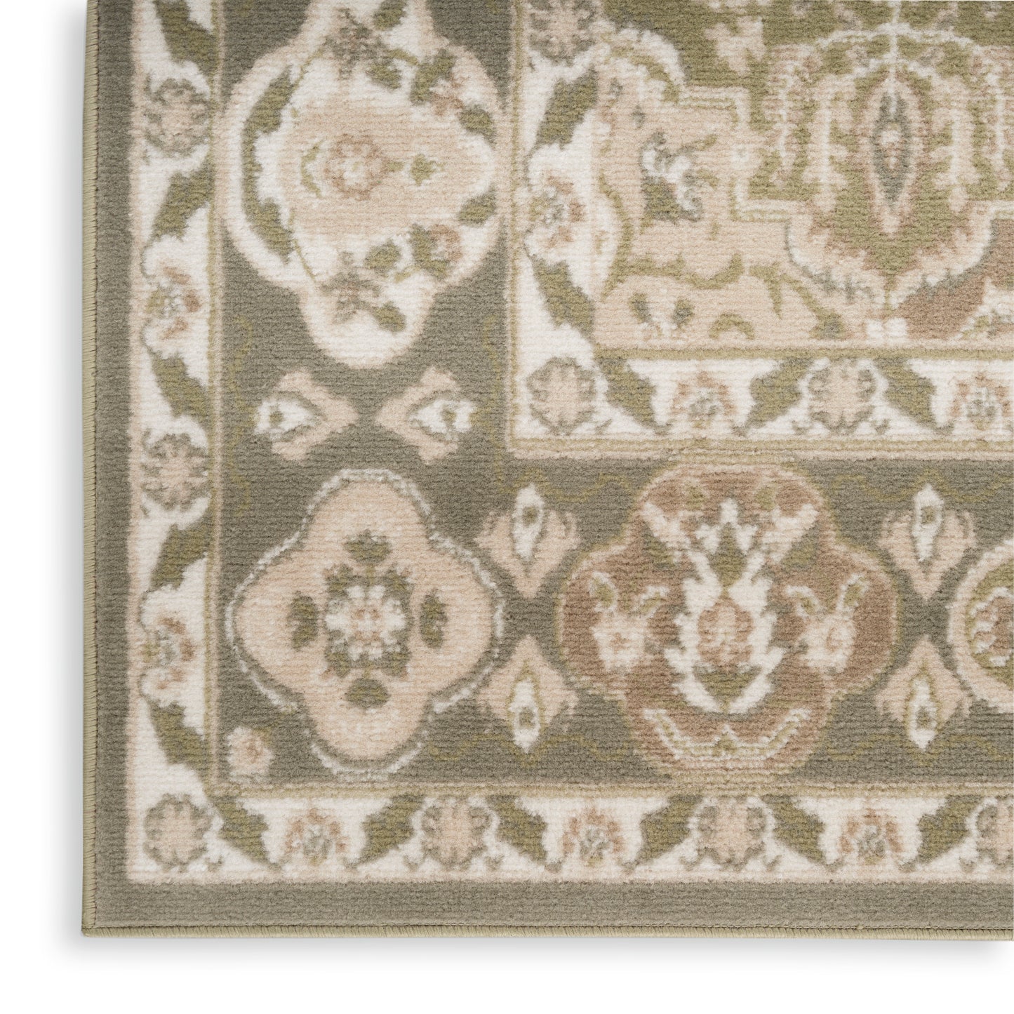 Corner of an oriental-style area rug featuring beige, ivory & olive floral medallions and a decorative border.
