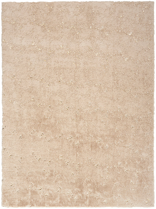 Beige rectangular shag rug with soft, plush pile and subtle texture in neutral tones.