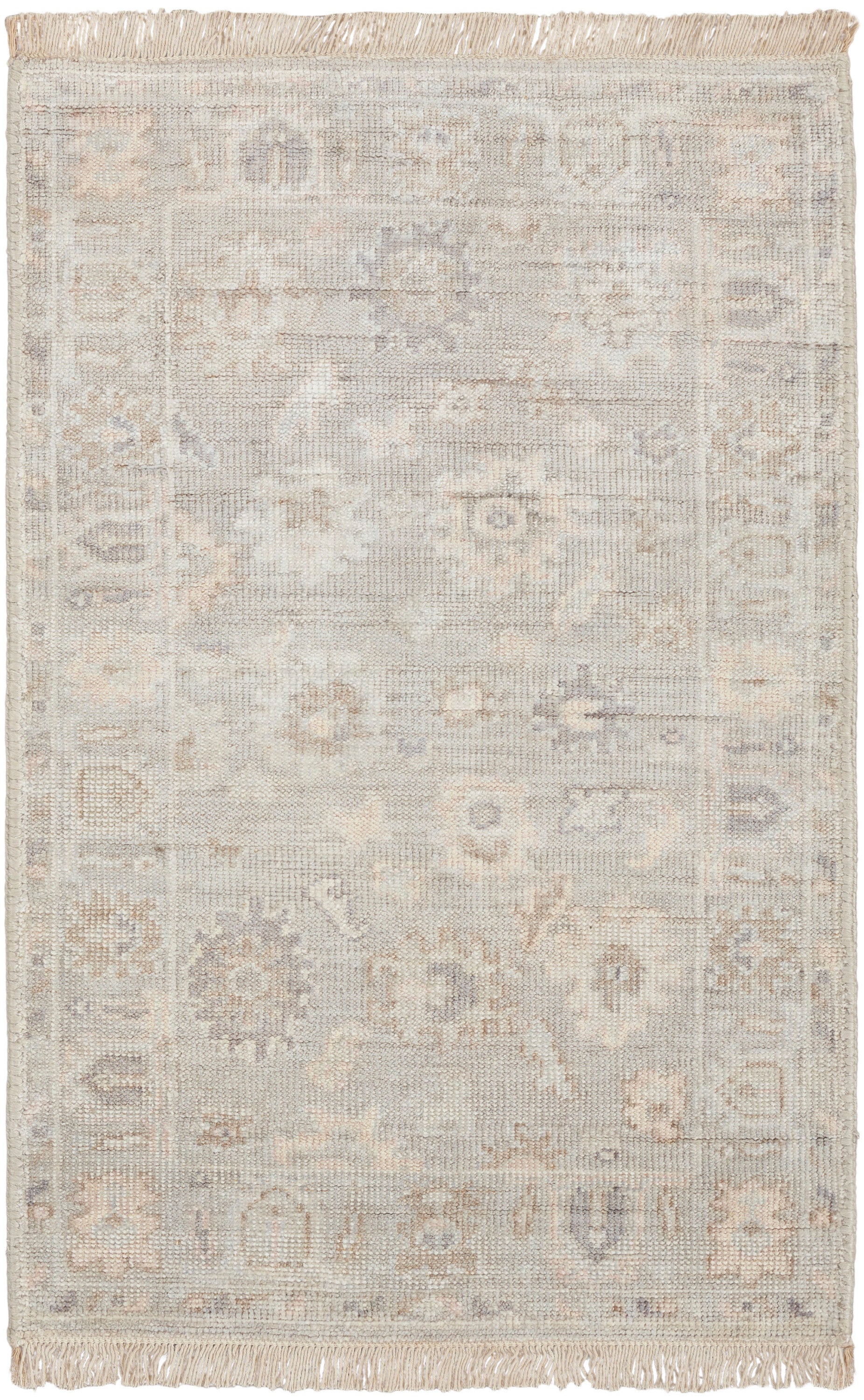 Neutral cream-gray oriental rug with faded motifs and a decorative border; fringed ends, soft woven texture for living room.