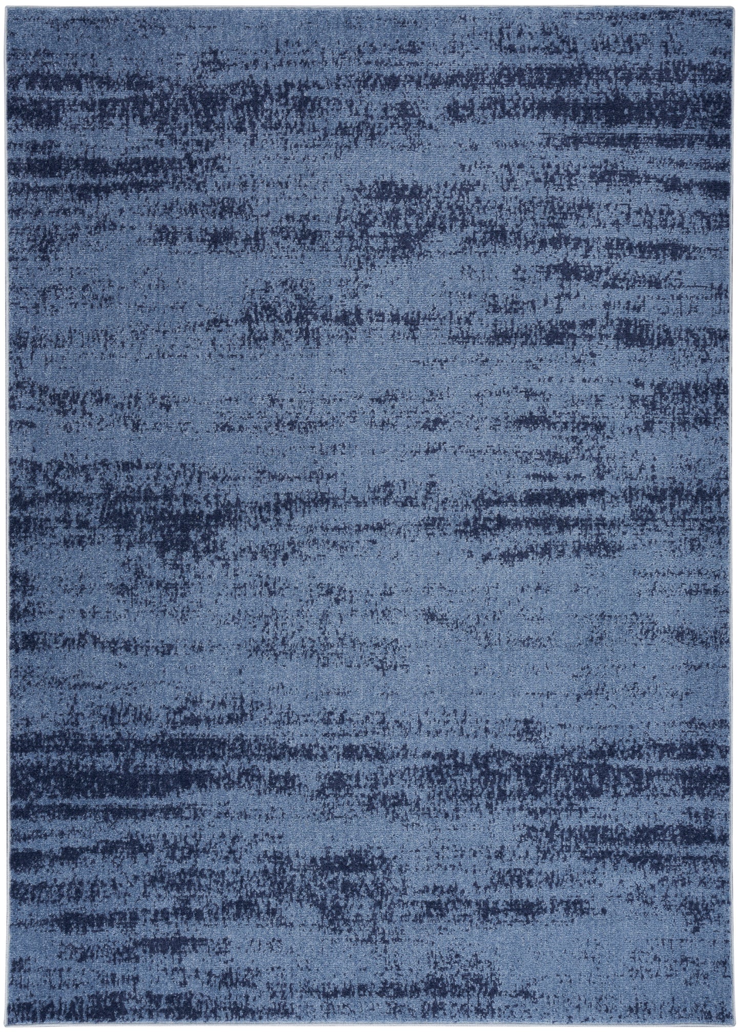 Blue abstract area rug with mottled dark and light blue tones and soft gradient.