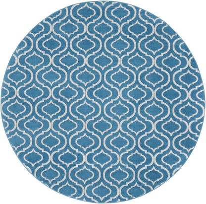 Round blue rug with a white Moroccan trellis pattern.