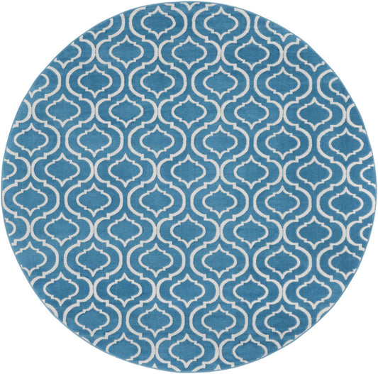Round blue rug with a white Moroccan trellis pattern.