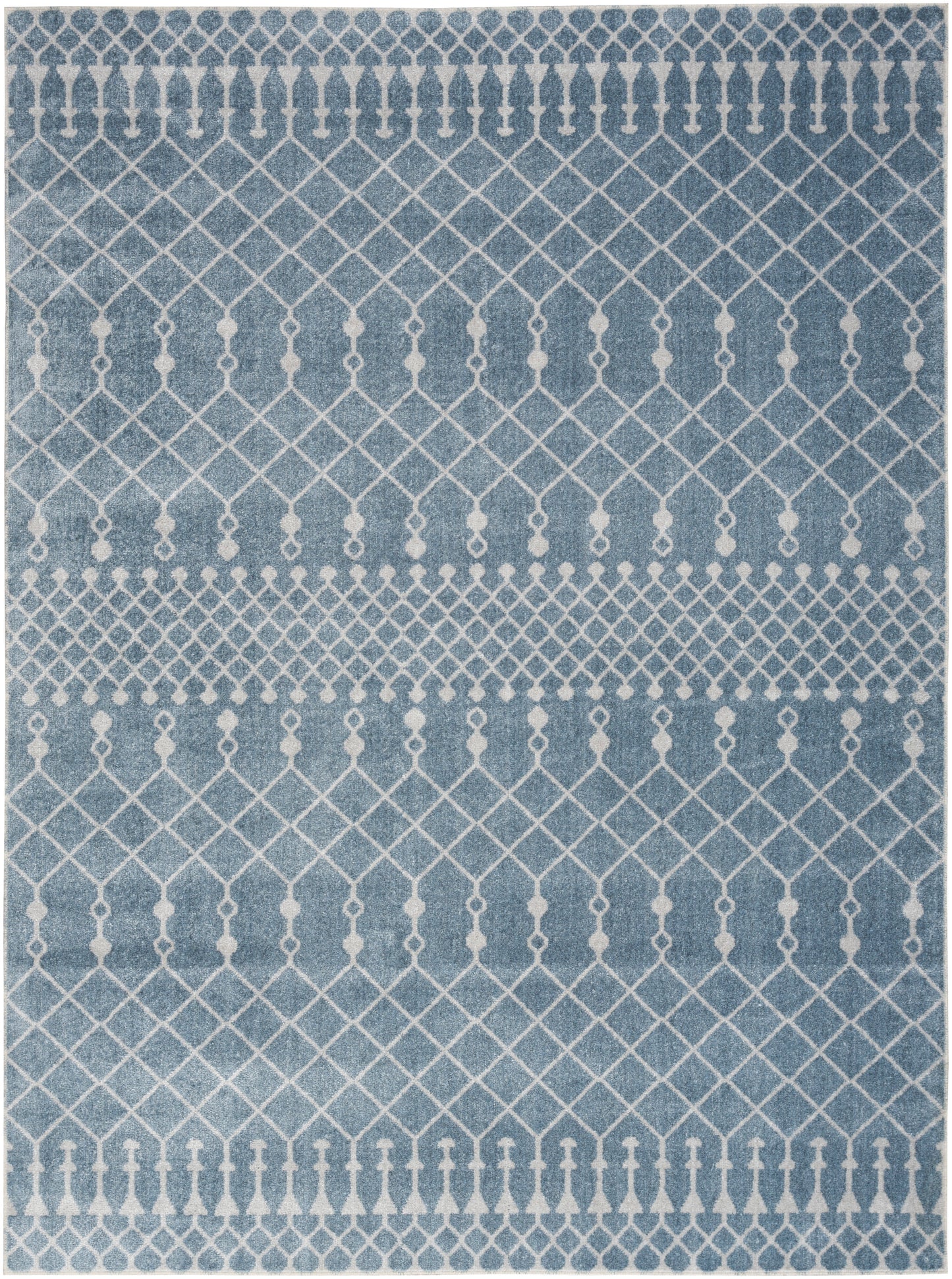 Blue rug with white geometric lattice diamonds and small tassel-like motifs; contemporary decor.