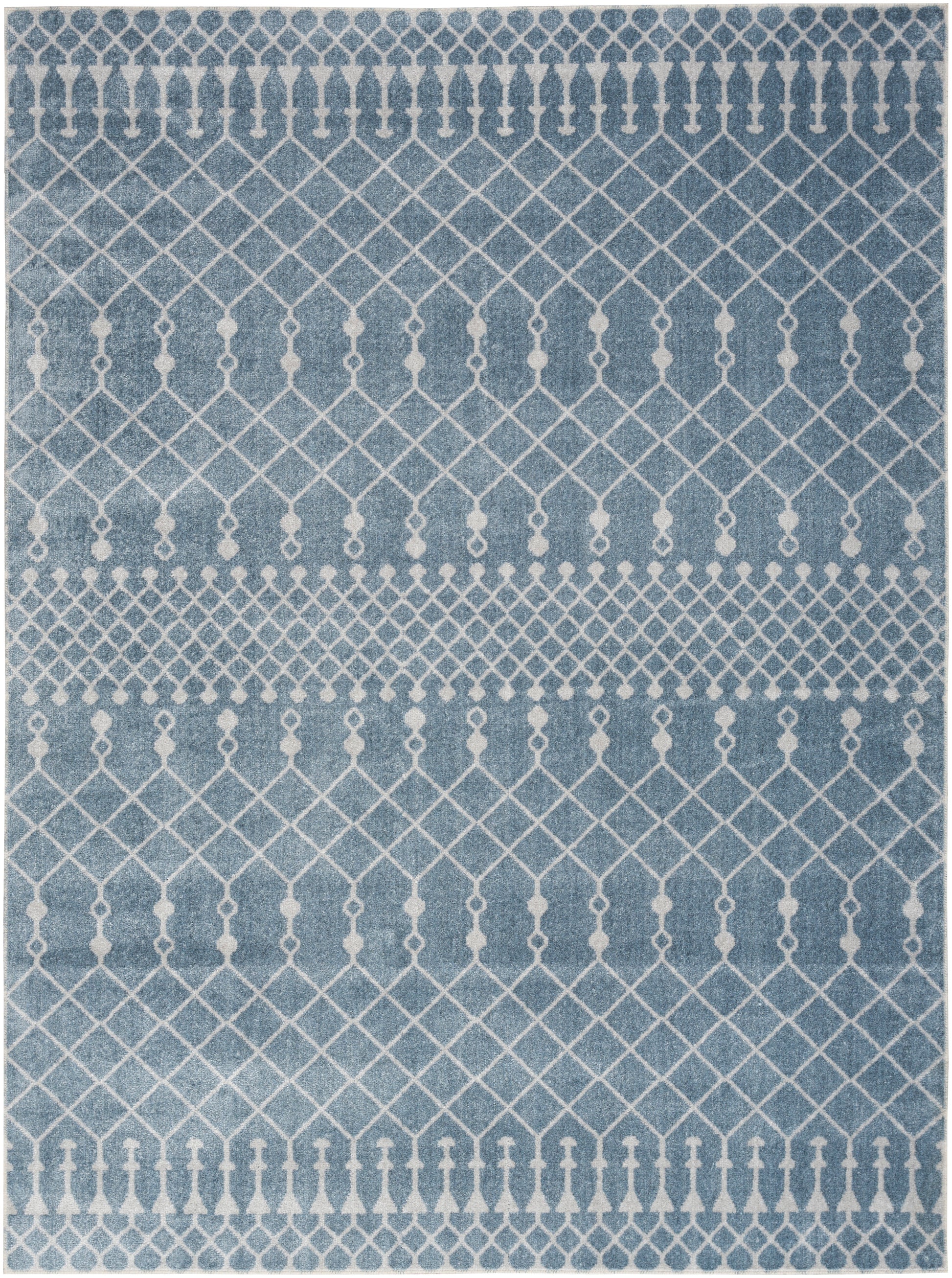 Blue rug with white geometric lattice diamonds and small tassel-like motifs; contemporary decor.