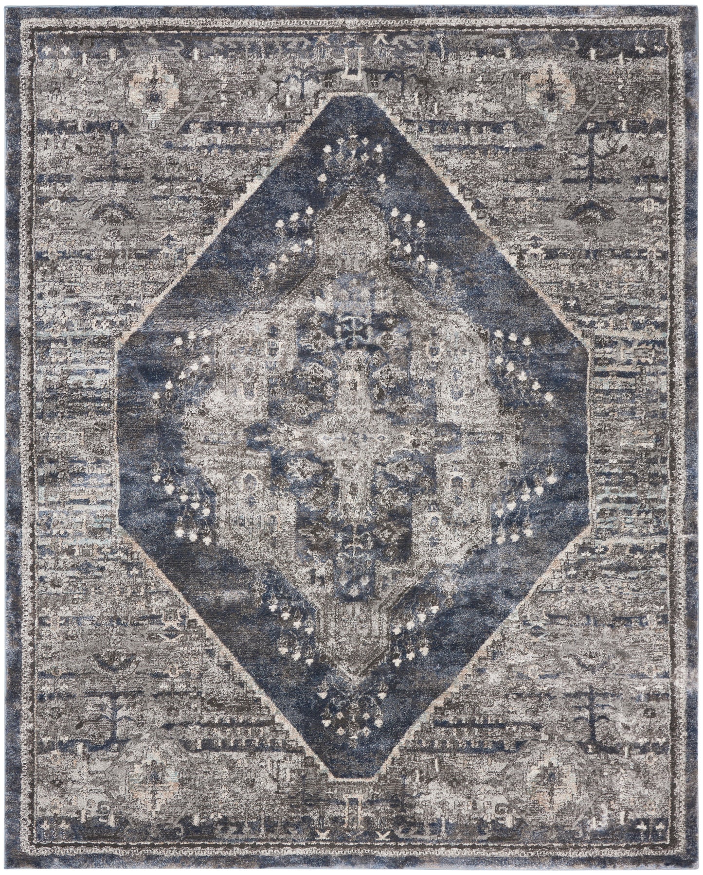 Distressed vintage-style rug with a navy blue diamond medallion on a gray field and faded ornate borders.