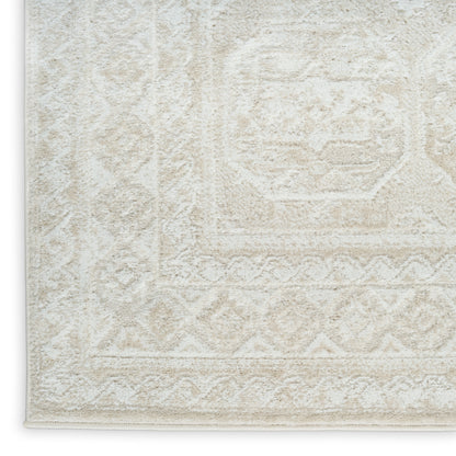 Cream textured area rug with subtle geometric medallion pattern, bound edge and plush pile.