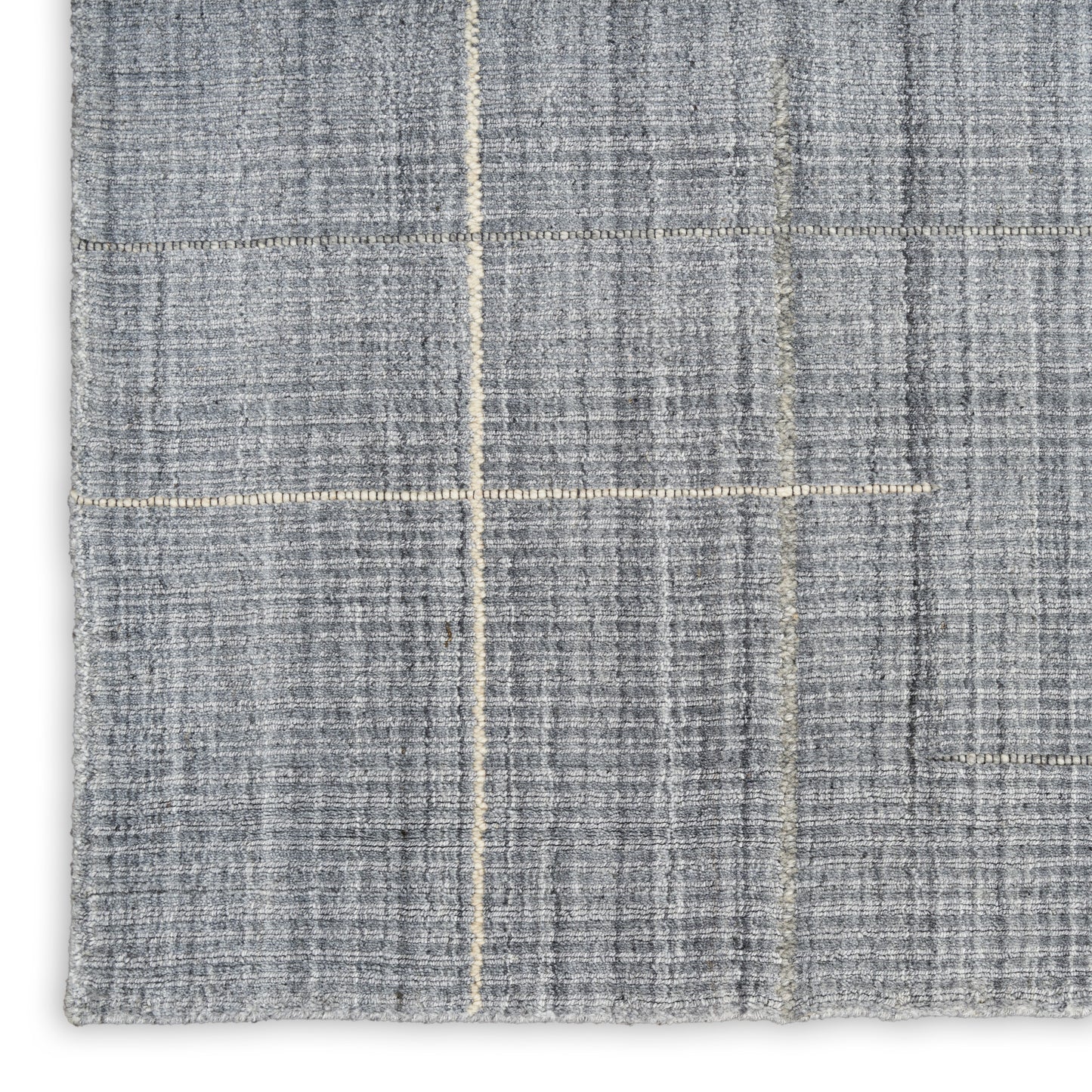 Grey woven rug with subtle beige windowpane plaid lines; close-up texture.