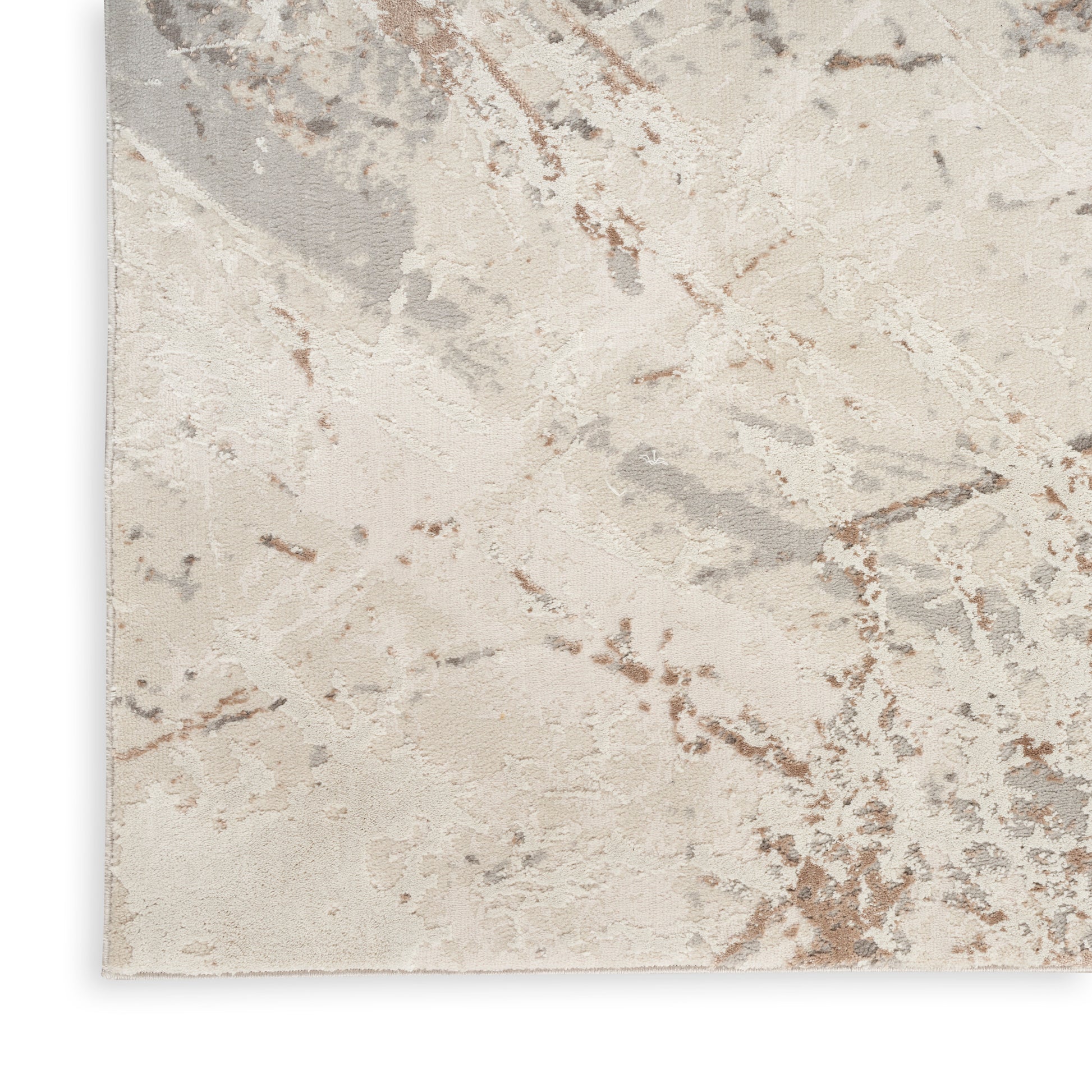 Neutral abstract area rug with marble-like cream, beige, gray and tan pattern; soft, textured surface.