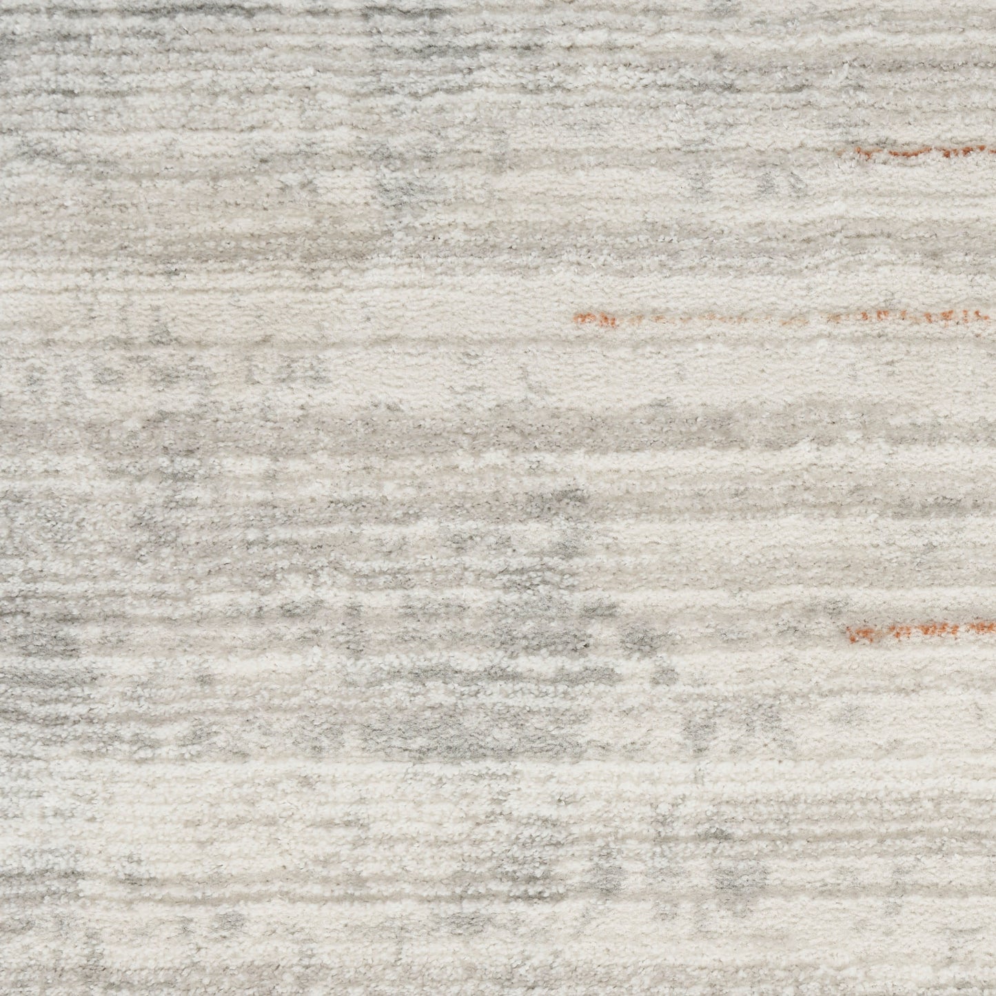 Light gray and ivory striped area rug with distressed texture; soft woven surface for modern living rooms.